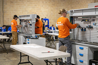 Mohawk College students working with tools at the Ontario Skills Competition