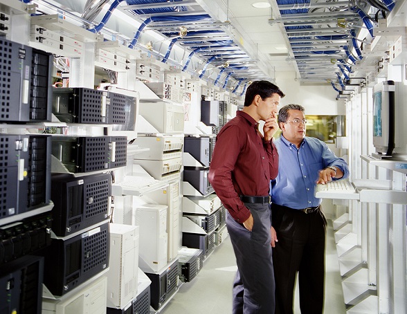 two people in a server room