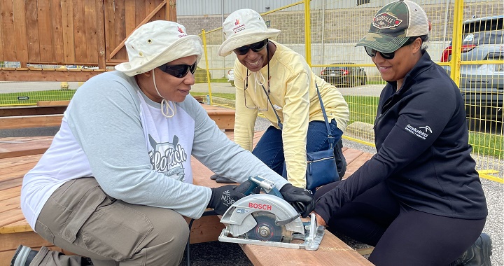 3 women building a deck