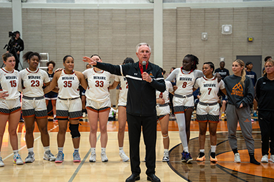 Ron Foxcroft doing a speech in the gymnasium.