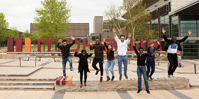 Students leaping in front of Mohawk College