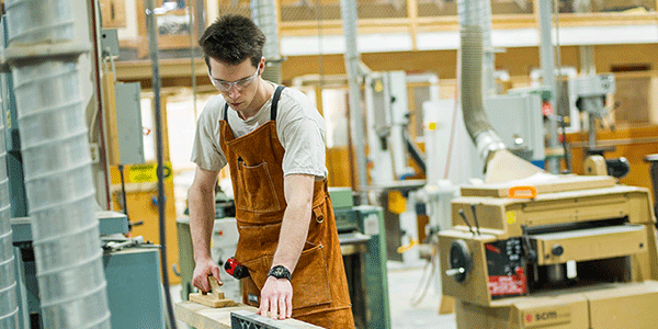 Mohawk student working in a general carpentry lab.