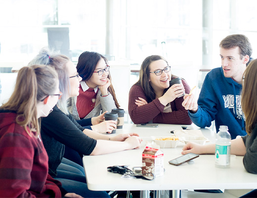 Mohawk college students sitting in the residence cafeteria