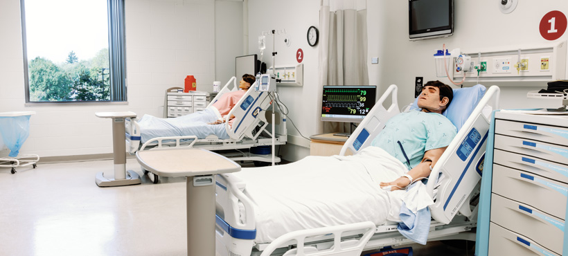 CHSR High Fidelity Suite 4 interior setup with two simulators, each in a hospital bed