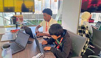 High School Students working on their laptops