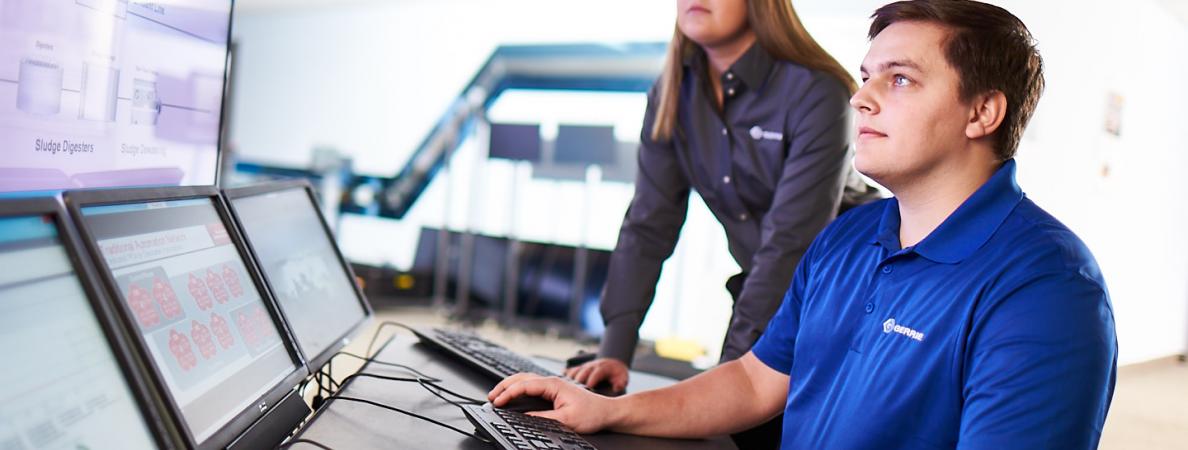 white male and female working on computer systems