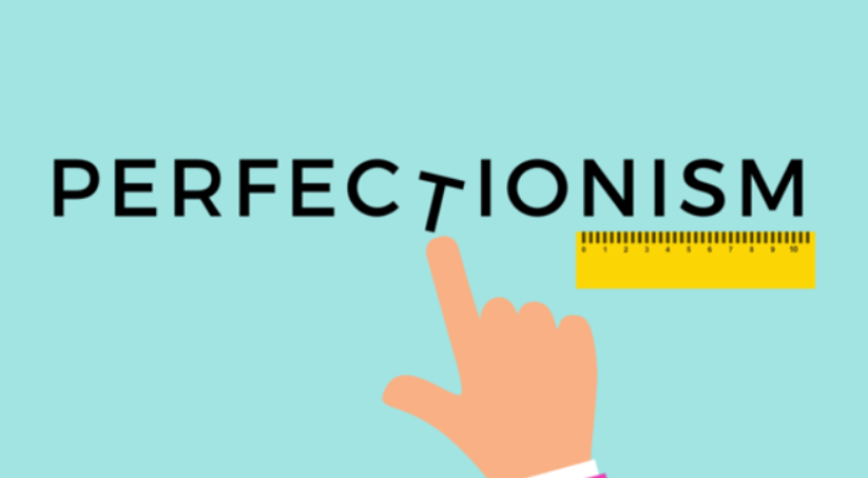 In the middle of the image is the word Perfectionism with a hand pointing at the letter T. 