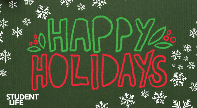 Snowflakes on a green background with the words "Happy Holidays" written.