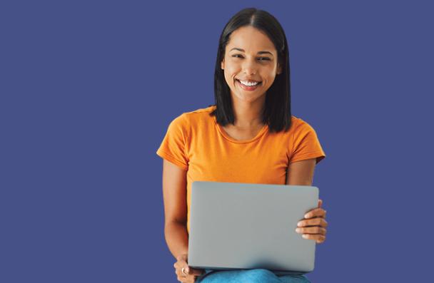 A student holding a laptop.