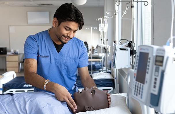 Arshdeep checking pulse on a lab mannequin.