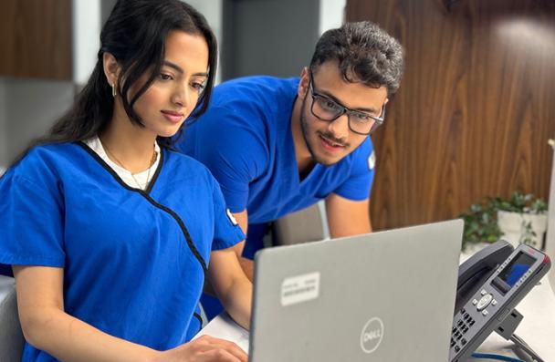 Two Medical Radiation Sciences Students looking at a laptop